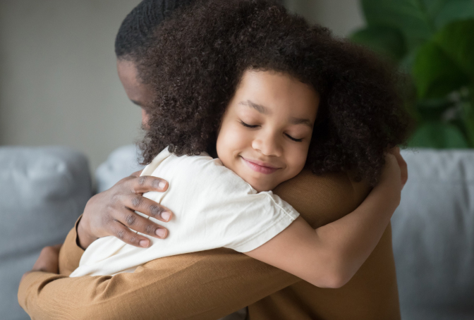 Parent with Child Photo of a Girl Hugging Her Father