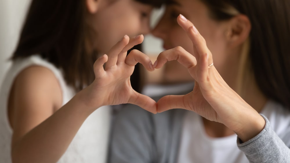 Finger Made Heart Child And A Mother Forming A Heart From Fingers