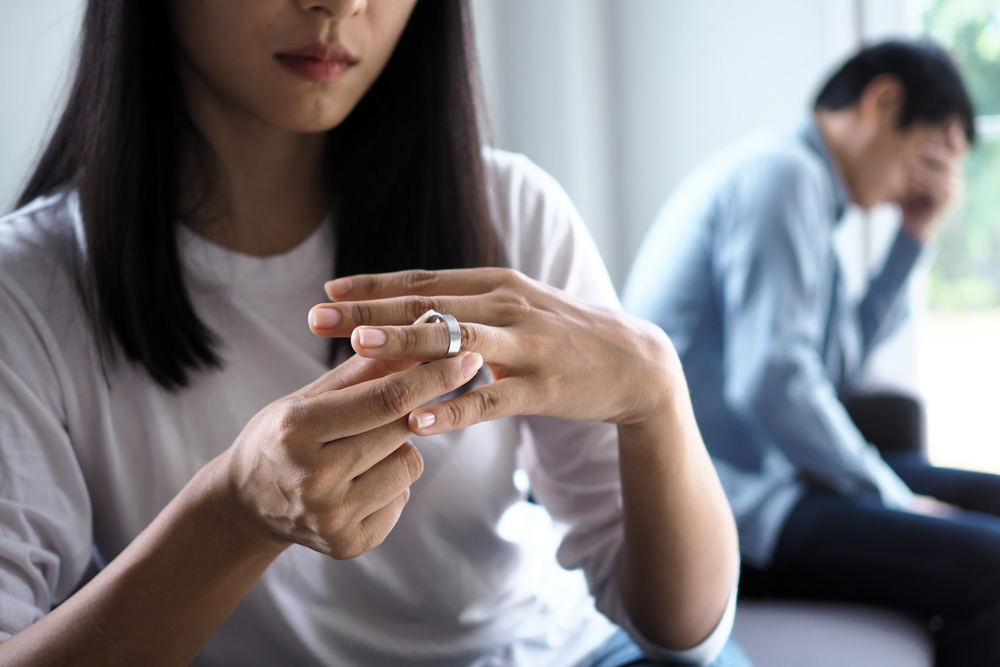 Woman Taking off Her Ring Photo of a Woman Taking off Her Ring